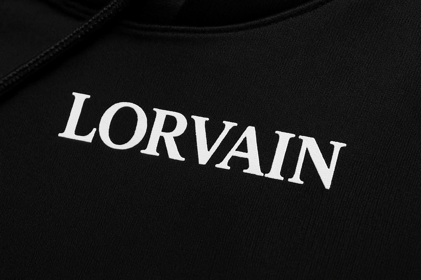 Black LORVAIN hoodie fabric and text close-up